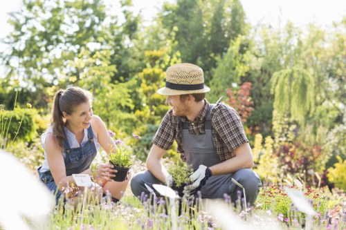 Staff separating recyclable garden waste with eco-friendly practices